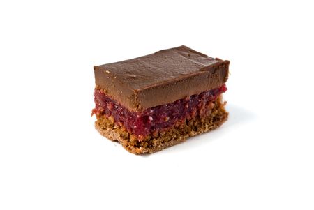 piece of a dark chocolate cake with sour cherry isolatedの写真素材