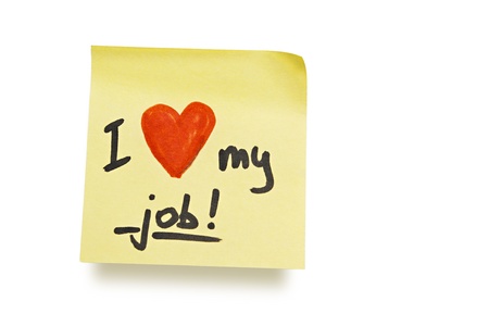 yellow adhesive note on white background with "i love my job" noteの写真素材
