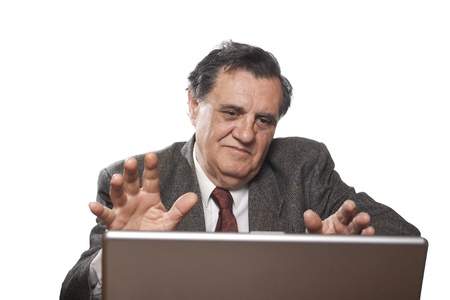 Senior businessman with laptop gesturing with hands isolated on white background