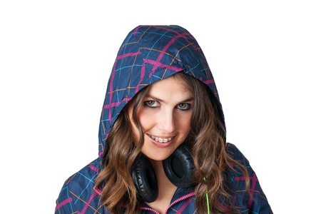 female in fitness outfit with headphones around her neck smiling