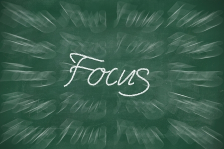 Focus written with chalk on school blackboardの写真素材