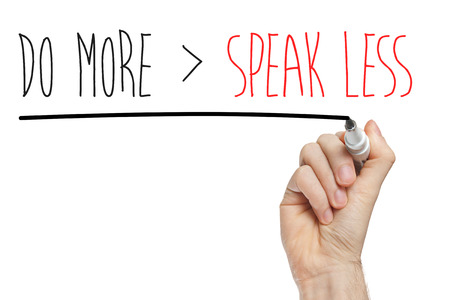 phrase speak less do more handwritten on whiteboardの写真素材
