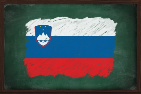 Slovenia flag painted with color chalk on old blackboardの写真素材