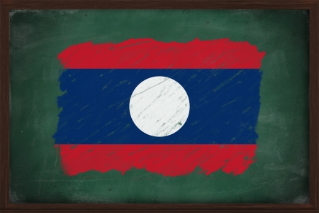 Laos flag painted with color chalk on old blackboardの写真素材