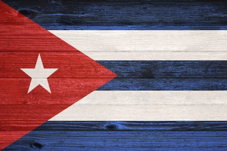 Cuba Flag painted on old wood plank backgroundの写真素材