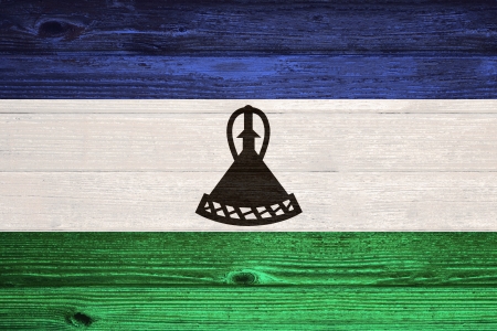 Lesotho Flag painted on old wood plank backgroundの写真素材