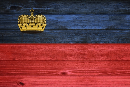 Liechstenstein Flag painted on old wood plank backgroundの写真素材