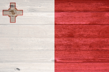 Malta Flag painted on old wood plank backgroundの写真素材