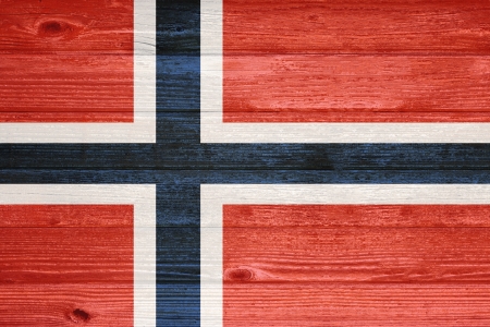 Norway Flag painted on old wood plank backgroundの写真素材