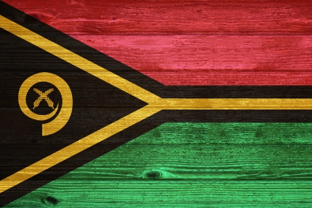 Vanuatu Flag painted on old wood plank backgroundの写真素材