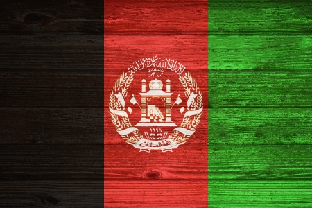 Afghanistan Flag painted on old wood plank backgroundの写真素材