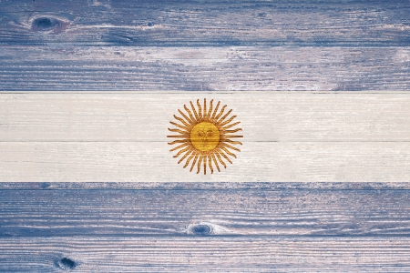 Argentina Flag painted on old wood plank backgroundの写真素材