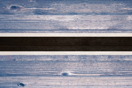 Botswana Flag painted on old wood plank backgroundの写真素材