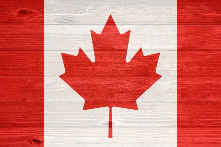 Canada Flag painted on old wood plank backgroundの写真素材