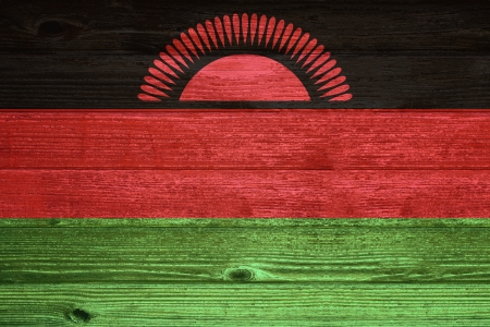 Malawi Flag painted on old wood plank backgroundの写真素材