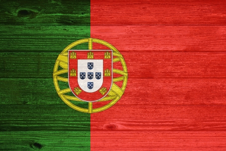 Portugal Flag painted on old wood plank backgroundの写真素材