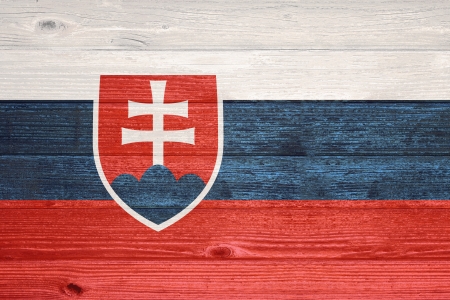 Slovakia Flag painted on old wood plank backgroundの写真素材