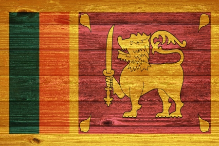 Sri Lanka Flag painted on old wood plank backgroundの写真素材