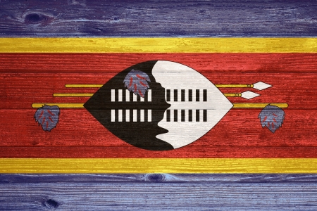 Swaziland Flag painted on old wood plank backgroundの写真素材
