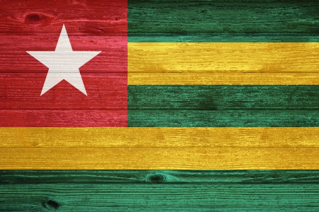 Togo Flag painted on old wood plank backgroundの写真素材