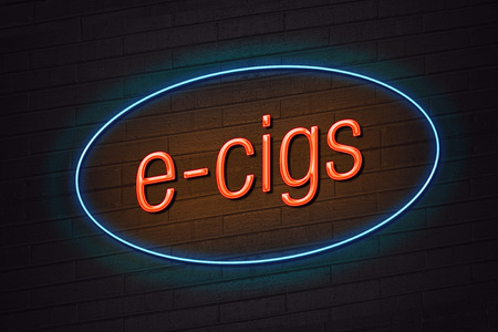 Orange neon sign with e-cigs text on wall e-cigarette conceptの写真素材