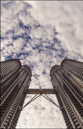 KUALA LUMPUR, MALAYSIA - MARCH 3  A view of the top of PETRONAS TWIN TOWERS with cloudy sky in the...