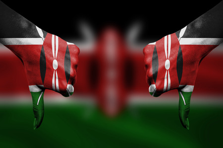 failure of Kenya - hands gesturing thumbs down in front of flagの写真素材