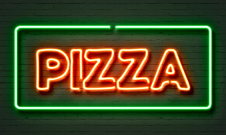 Pizza neon sign on brick wall backgroundの写真素材