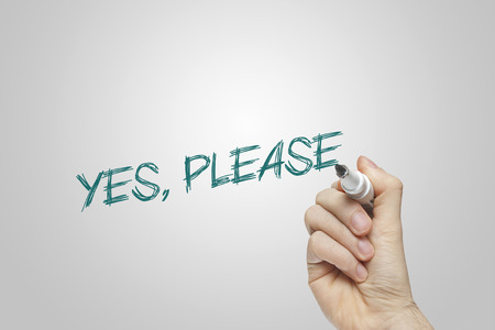 Hand writing yes please on grey backgroundの写真素材