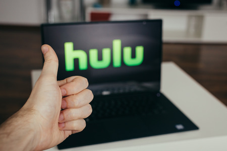 ZAGREB, CROATIA - DECEMBER 20 2015: Hulu on modern laptop screen, man showing thumbs up. Hulu is an American online company and partially ad-supported streaming service.のeditorial素材
