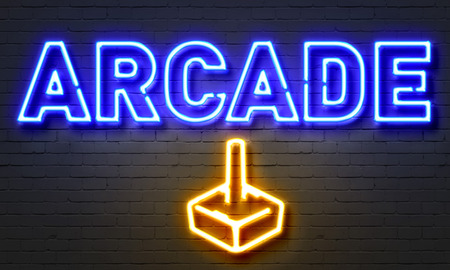 Arcade neon sign on brick wall backgroundの写真素材
