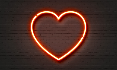 Heart neon sign on brick wall backgroundの写真素材