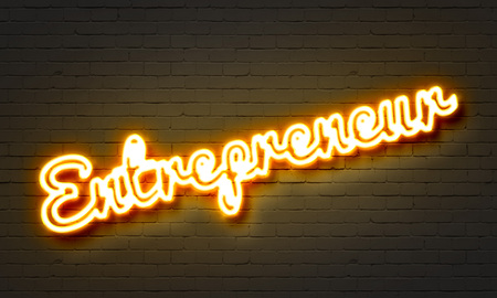 Entrepreneur neon sign on brick wall backgroundの写真素材