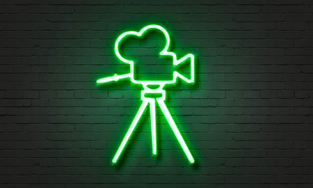 Film camera neon sign on brick wall backgroundの写真素材