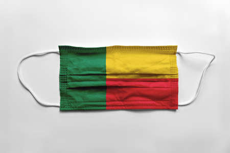 Face mask with Benin flag printed, on white background, isolated.の写真素材