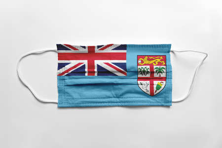 Face mask with Fiji flag printed, on white background, isolated.の写真素材