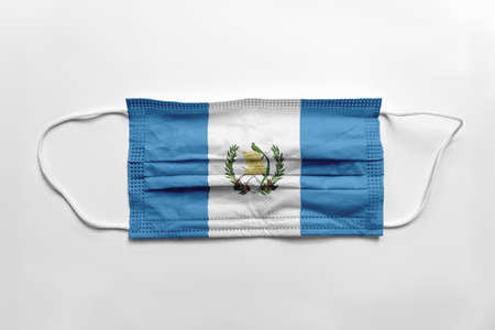 Face mask with Guatemala flag printed, on white background, isolated.の写真素材