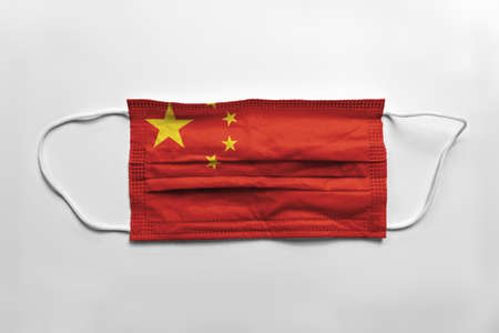 Face mask with Montenegro flag printed, on white background, isolated.の写真素材