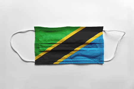 Face mask with Tanzania flag printed, on white background, isolated.の写真素材