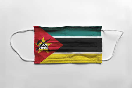Face mask with Mozambique flag printed, on white background, isolated.の写真素材