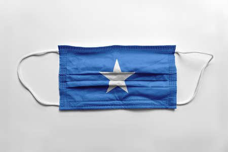 Face mask with Somalia flag printed, on white background, isolated. Covid-19 concept.の写真素材