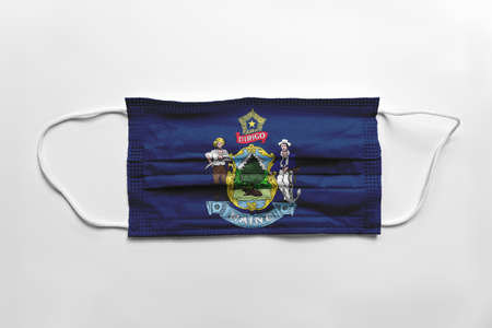 Face mask with Maine printed, on white background, isolated safety conceptの写真素材