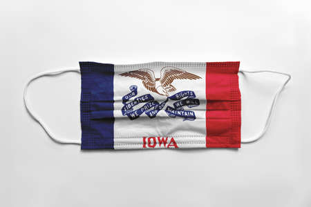 Face mask with flag printed, on white background, isolated safety conceptの写真素材
