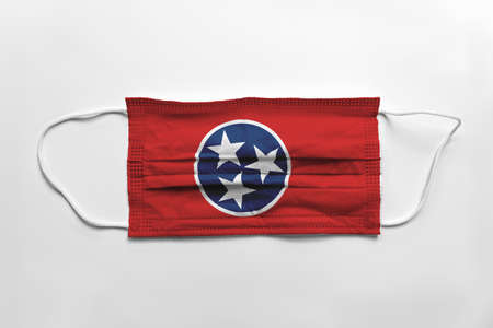 Face mask with Tennessee flag printed, on white background, isolated safety conceptの写真素材