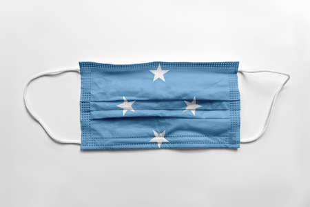 Face mask with Federated States of Micronesia flag printed, on white background, isolated.の写真素材