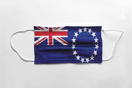 Face mask with Cook Islands flag printed, on white background, isolated.の写真素材