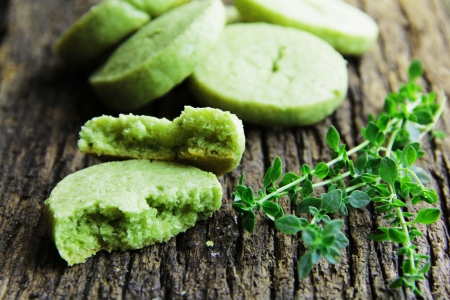 Green, biscuits with parmesan cheese, thyme and tea match の写真素材