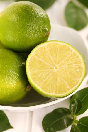 Limes in the plate  の写真素材