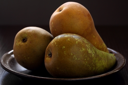 Pears in a plate on a gray background  の写真素材