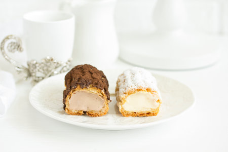 Sectional homemade eclairs, chocolate and vanilla.